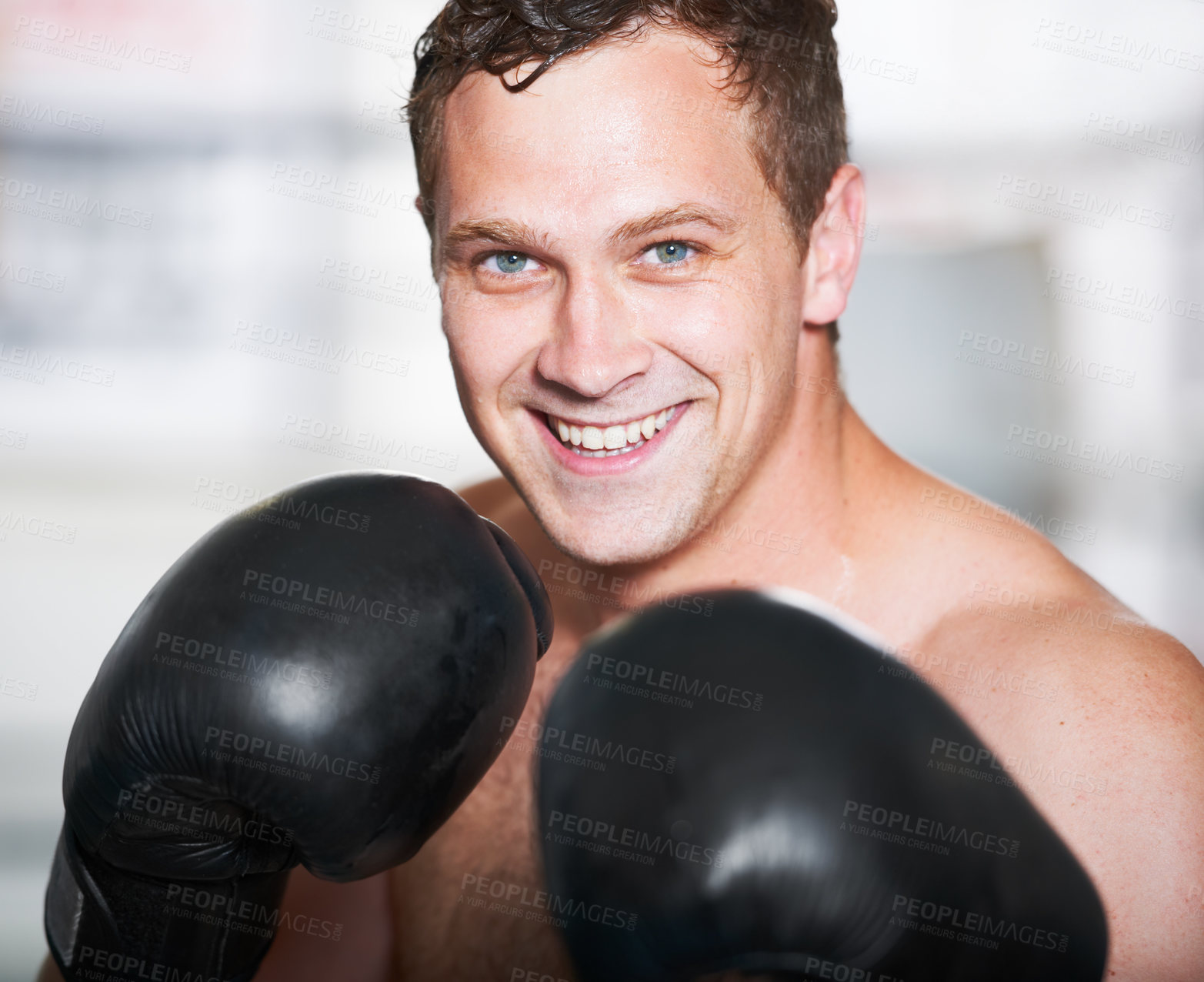 Buy stock photo Boxing, gloves and portrait of happy man with fitness, power and training for challenge in gym. Strong body, muscle and smile, boxer or athlete with fist up, face and confidence in competition fight.