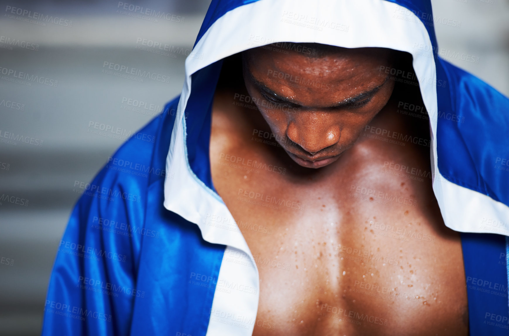 Buy stock photo Black man, robe and boxing champion getting ready for fight, challenge or sports competition at gym or ring. Serious African male person, fighter or boxer in preparation for MMA match or game start