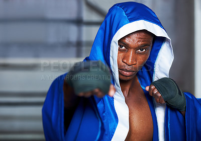 Buy stock photo Black man, portrait and boxing champion in robe getting ready for fight, challenge or sports competition at gym. Serious African male person, fighter or professional boxer in MMA, match or game start