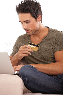 Buy stock photo Laptop, credit card and relax with man on sofa for online shopping, digital payment and fintech. Ecommerce, banking and bills with male customer in living room of home for technology and web