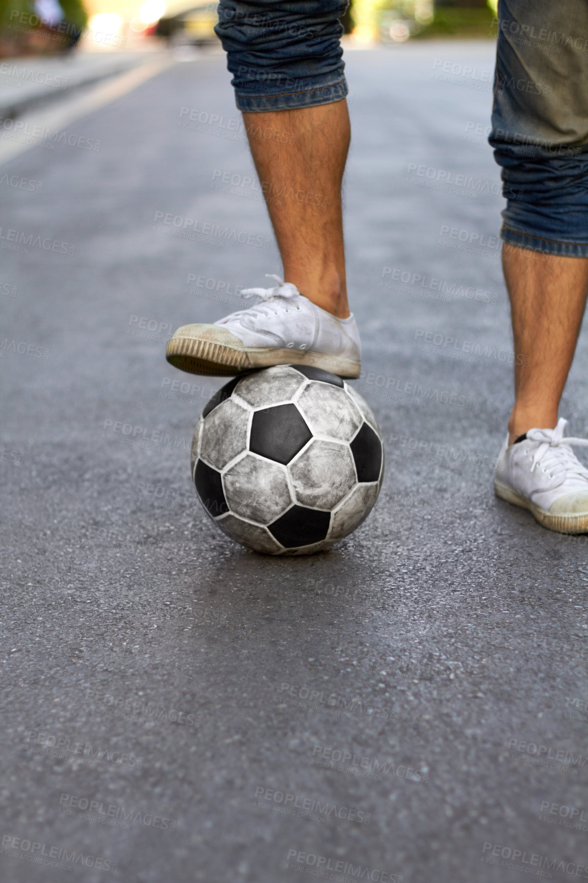 Buy stock photo Ready, street and feet of a person for soccer, game and training for sports. City, sneakers and legs of a man with a football for sport, exercise and urban fitness in the road while playing a match