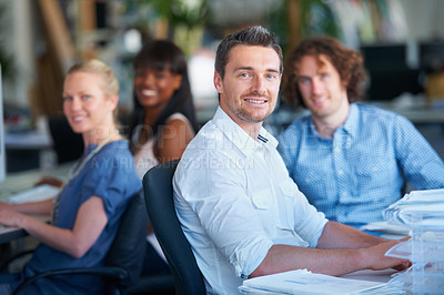Buy stock photo Cropped shot of four businesspeople sitting in the office