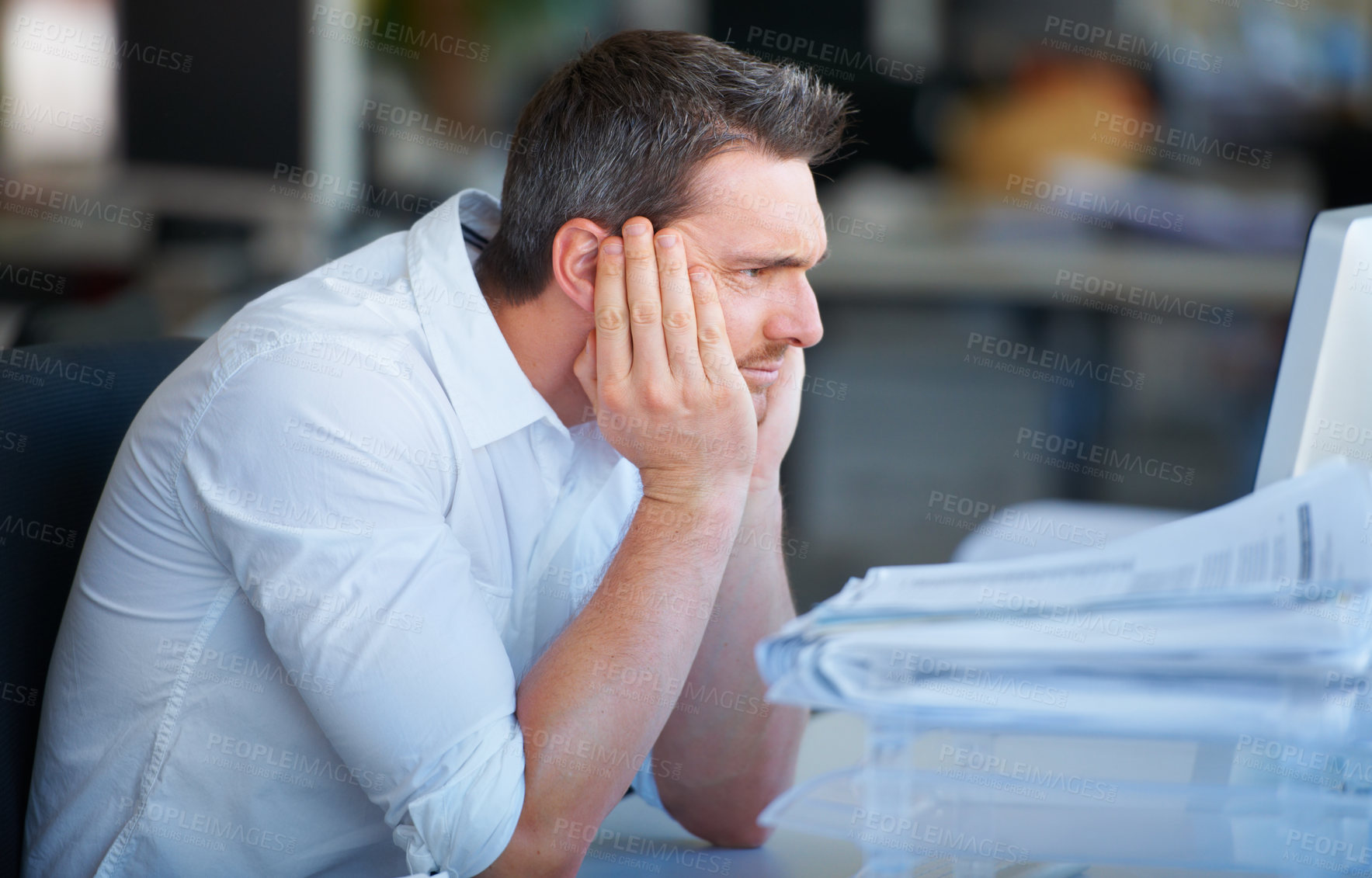 Buy stock photo Mental health, businessman with a headache and at his desk of a modern workplace office with fatigue. Stress or anxiety, mistake or problem and tired or frustrated male person at his workspace 