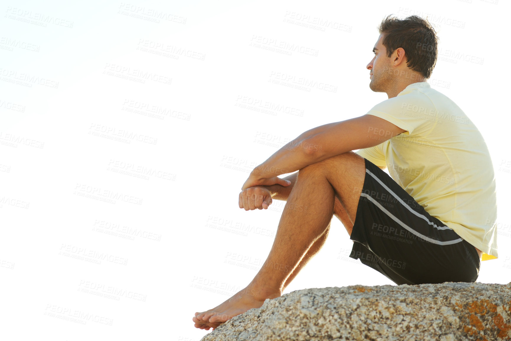 Buy stock photo Man, thinking or rock and cliff in nature for travel, adventure or scenery with sunshine, vision and view. Person, mountain or sky for holiday, vacation or experience outdoor and freedom or barefoot