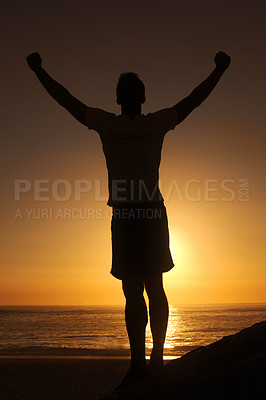Buy stock photo Sunset, beach and silhouette of fitness man with arms up celebration in nature, excited or victory. Energy, shadow and male athlete at the ocean with freedom, achievement or training goal success