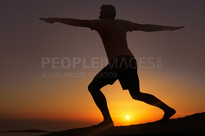 Buy stock photo Silhouette of a man doing exercises with the sunset in the background