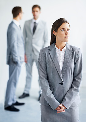 Buy stock photo Businesswoman, serious and thinking for future in law career, standing and ready for job. Worker, corporate attorney in suit and professional in workplace, colleagues in background and confident