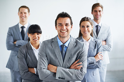 Buy stock photo Businessman, portrait and leader with team, arms crossed and happy for future in finance career. Colleagues, accountants in suit and professional in workplace, people in background and confident
