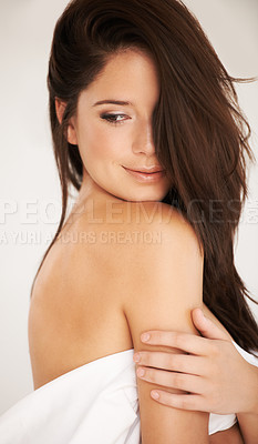 Buy stock photo Shot of a beautiful woman posing in white linen