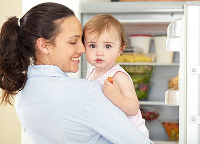 Buy stock photo Happy woman, toddler and face in kitchen, fridge and food for eating, hunger or snack. Mother, little girl and fruit for nutrition, yummy and delicious for vegetarian, healthy and diet in home