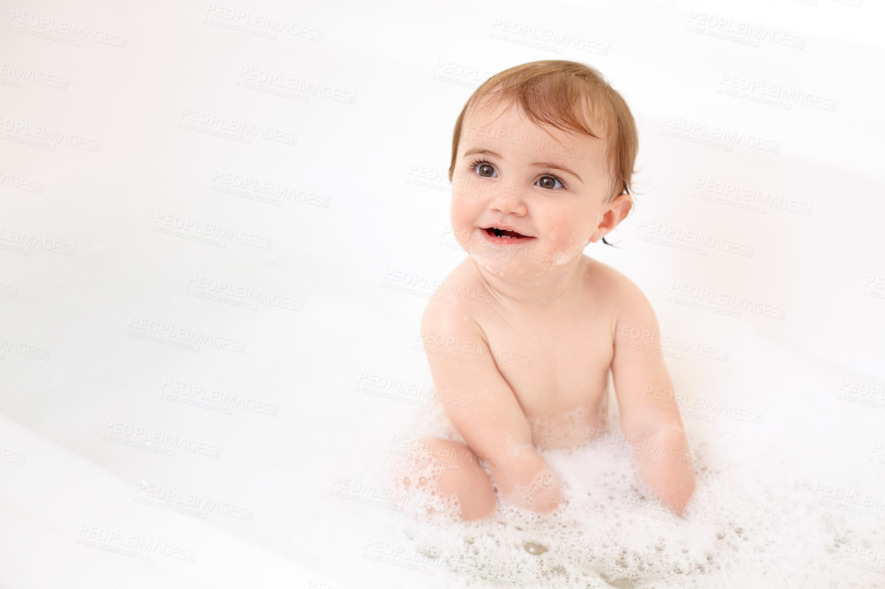 Buy stock photo Baby in bath with soap, water and clean fun in home for skincare, wellness and hygiene. Bubble bathtub, foam and happy child in bathroom with cute face, care and washing body of dirt, germs and smile