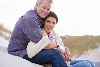 Buy stock photo Couple, face and laughing in nature with hug for romance, love and relationship on beach with relax. Mature, man and woman or embrace with happy, peace and comfort for bonding, honeymoon and support 