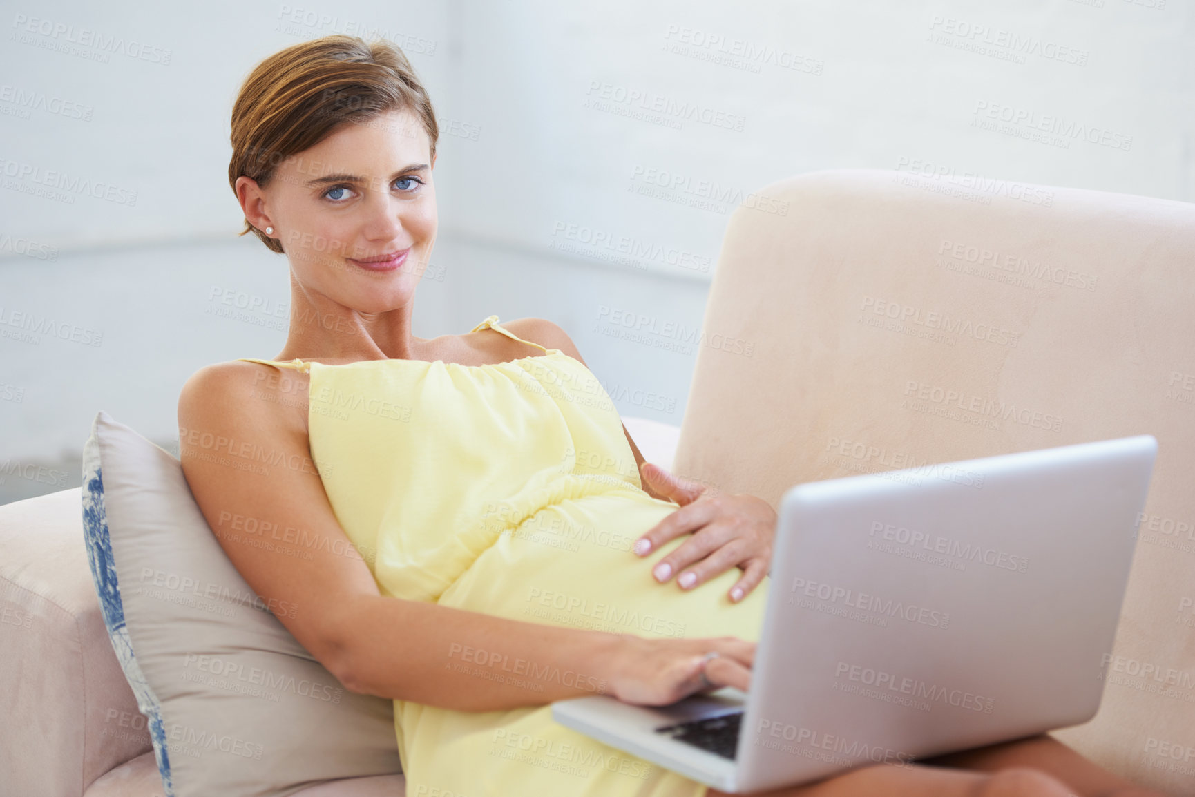 Buy stock photo Portrait, pregnant and woman on laptop in house living room for childcare website, information or birth learning. Smile, happy or relax person on home sofa with technology, research or pregnancy blog