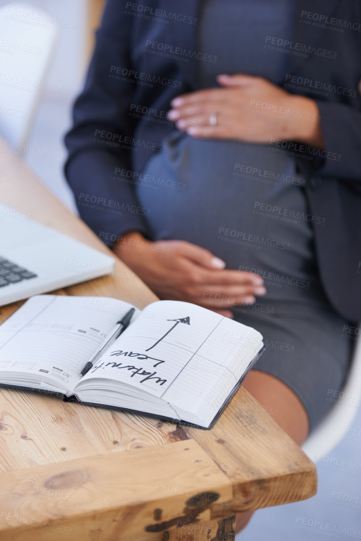 Buy stock photo Woman, pregnant and maternity date in book for work break, childcare or waiting for motherhood. Female person, stomach and hands as professional employee for career relax, note for infant schedule