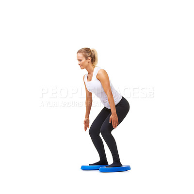 Buy stock photo Balance, squat and fitness with woman on disk in studio for workout, health or exercise. Wellness, challenge and training with female person on white background for flexibility, smile or aerobics