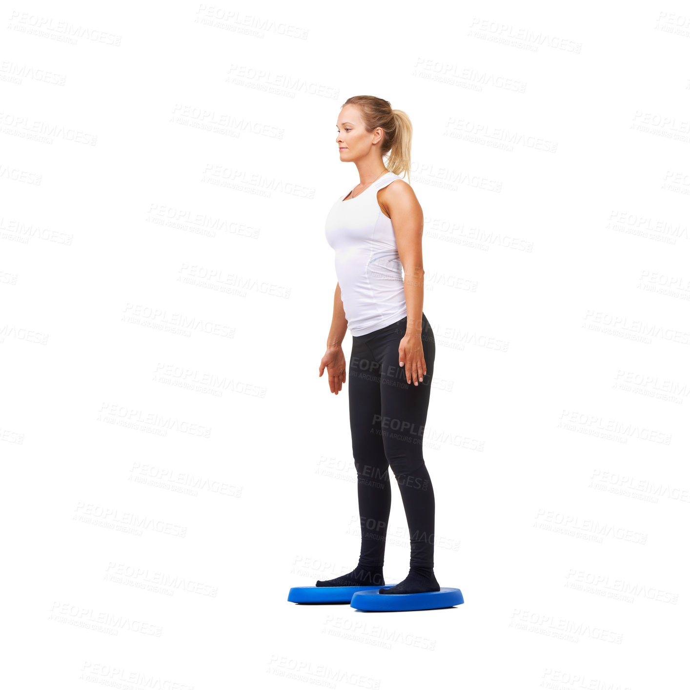 Buy stock photo Balance, exercise and training with woman on disk in studio for workout, mindfulness or health. Wellness, challenge and fitness with person on white background for flexibility, smile or aerobics