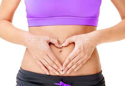 Buy stock photo Cropped shot of a woman making a heart-shape on her stomach with her hands isolated on white