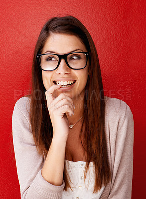 Buy stock photo Cropped view of a young woman wearing glasses and looking away with a smile