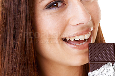 Buy stock photo Happy, eating and portrait of woman with chocolate in a studio for dessert with positive attitude. Smile, face and closeup of young female person enjoying candy for snack isolated by white background