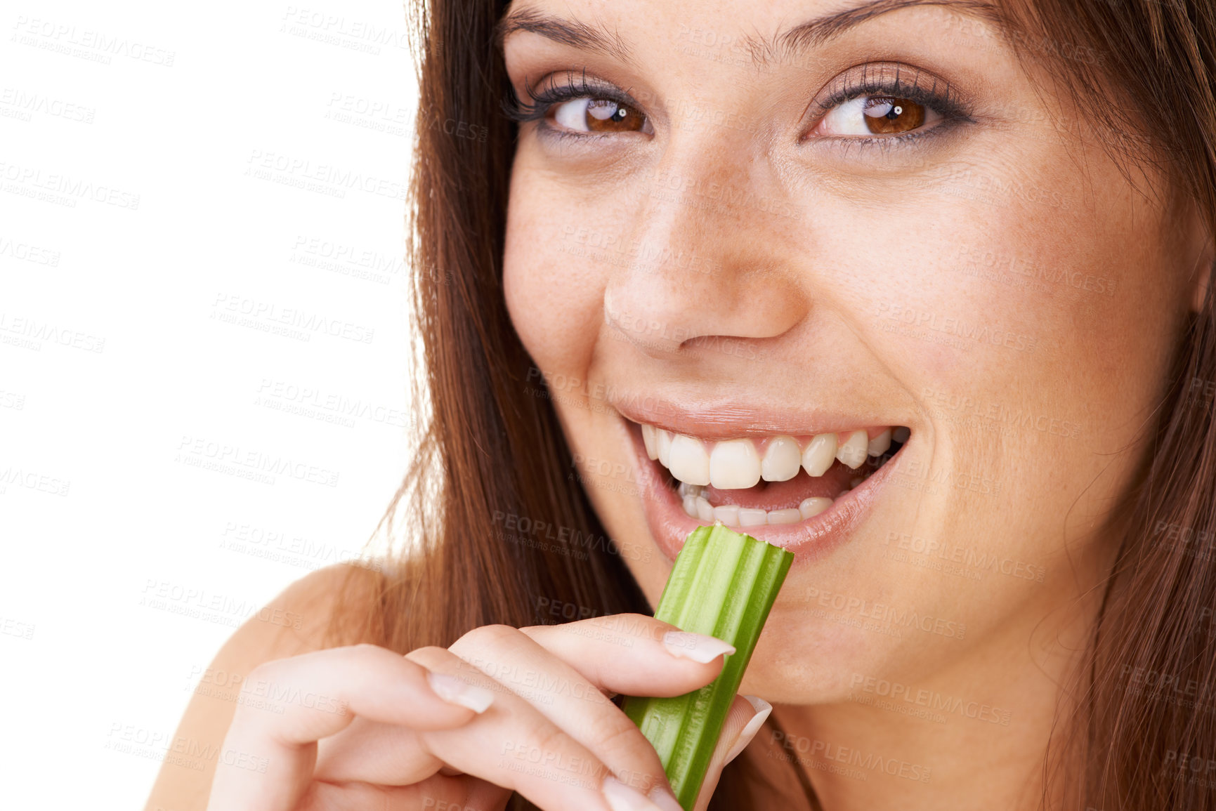 Buy stock photo Portrait of a beautiful young woman eating a stick of celery