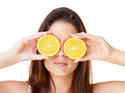 Buy stock photo Woman cover face with orange fruits in studio for detox, vegan diet and natural skincare for nutrition on white background. Serious girl, citrus and healthy food for sustainable benefits of vitamin c