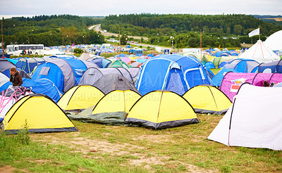 Buy stock photo Tents, field and music festival outdoor for dancing event in forest for party celebration, rave weekend on vacation. Campsite, land and crowd for concert dj disco accommodation, park trip in nature