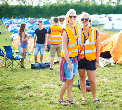 Buy stock photo Portrait, sunglasses and event staff at festival for music, party and carnival outdoor in summer. Happy women, girls camping and security team in headset, safety vest or celebration concert in nature