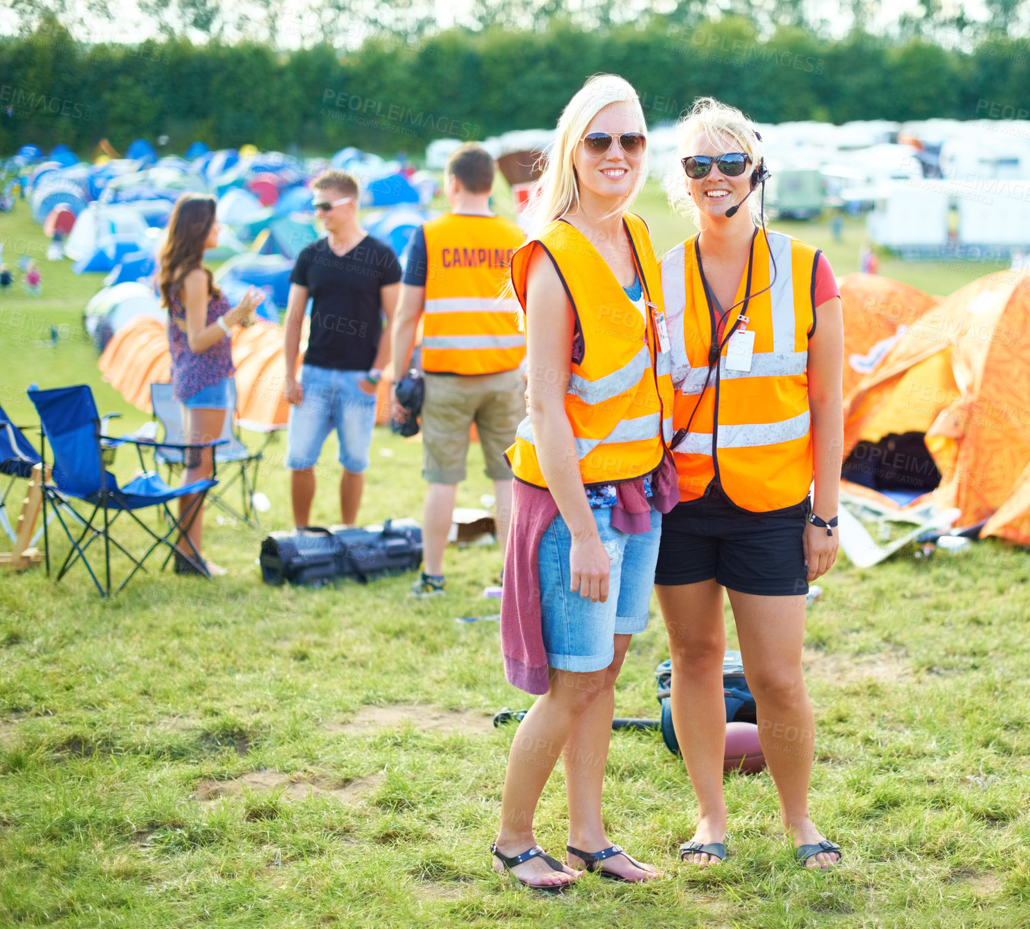 Buy stock photo Portrait, sunglasses and event staff at festival for music, party and carnival outdoor in summer. Happy women, girls camping and security team in headset, safety vest or celebration concert in nature