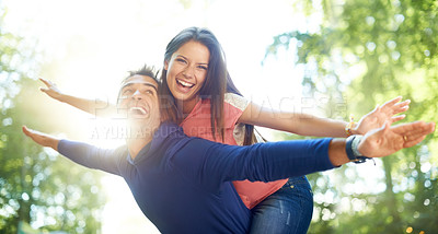Buy stock photo Outdoor, piggy back and couple with love, nature and summer with lens flare, marriage and adventure. Portrait, man carrying woman and woods for fun, playing and journey with relationship and romance