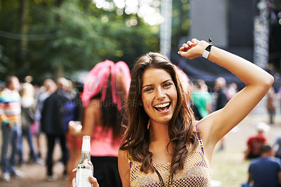 Buy stock photo Music, festival and portrait of woman at a concert, stage and  celebration with alcohol, bottle or beer at event. Happy, girl and dancing at party with audience, crowd and excited fan at techno rave