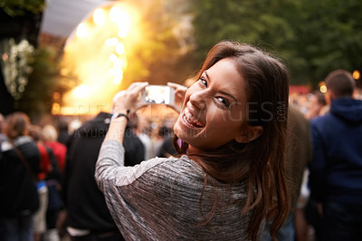 Buy stock photo Woman, music festival and cellphone picture of stage entertainment, party concert or crowd audience. Female person, mobile device and performance rock event or rave, photography or dj celebration