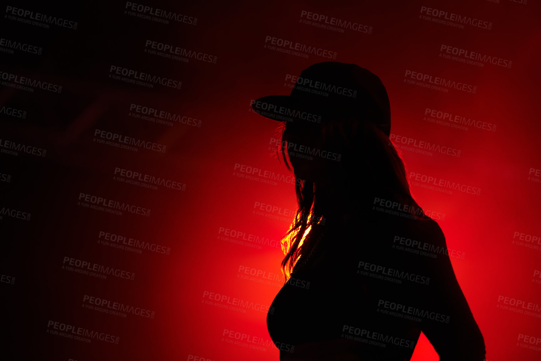 Buy stock photo Woman, red light and silhouette at party concert or festival night, stage event or dark. Female person, strobe and glow for artistic creative shadow for dance rave, entertainment or mockup background