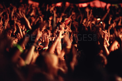 Buy stock photo People, hands and crowd for music, festival and outside with arms raised for dancing, movement or enjoyment. Audience, concert and excitement with dj, band or singer with red, lighting and equipment