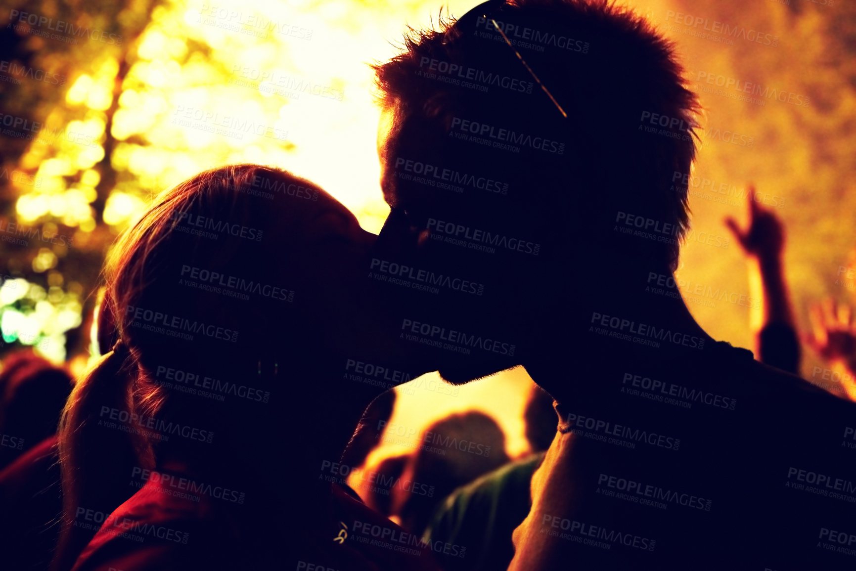 Buy stock photo Outdoor, silhouette and couple with love, kiss and party with social event, romance and relationship. Romantic, man and woman with weekend break, fun and night with marriage, crowd and celebration