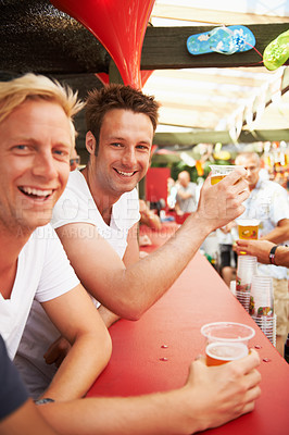 Buy stock photo Happy man, friends and drinking at music festival, bar or event for summer party or DJ concert. Portrait of male person smile with alcohol or beer for friendship at carnival or outdoor cafe stand
