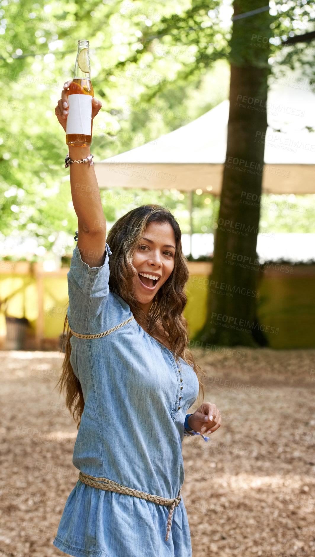 Buy stock photo Portrait, excitement and hand up with a woman at a music festival, drinking beer in celebration. Freedom, energy and shouting with a happy young person outdoor at a concert, show or performance