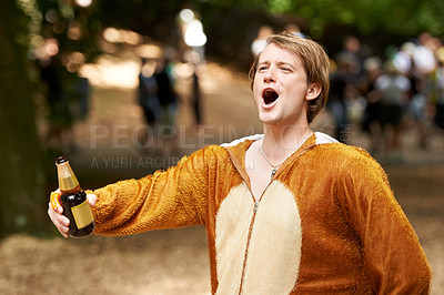 Buy stock photo Animal, costume and man with beer at festival in field with crazy, energy and drunk in summer or holiday. Person, drink and celebrate on vacation at concert or carnival with happiness and freedom