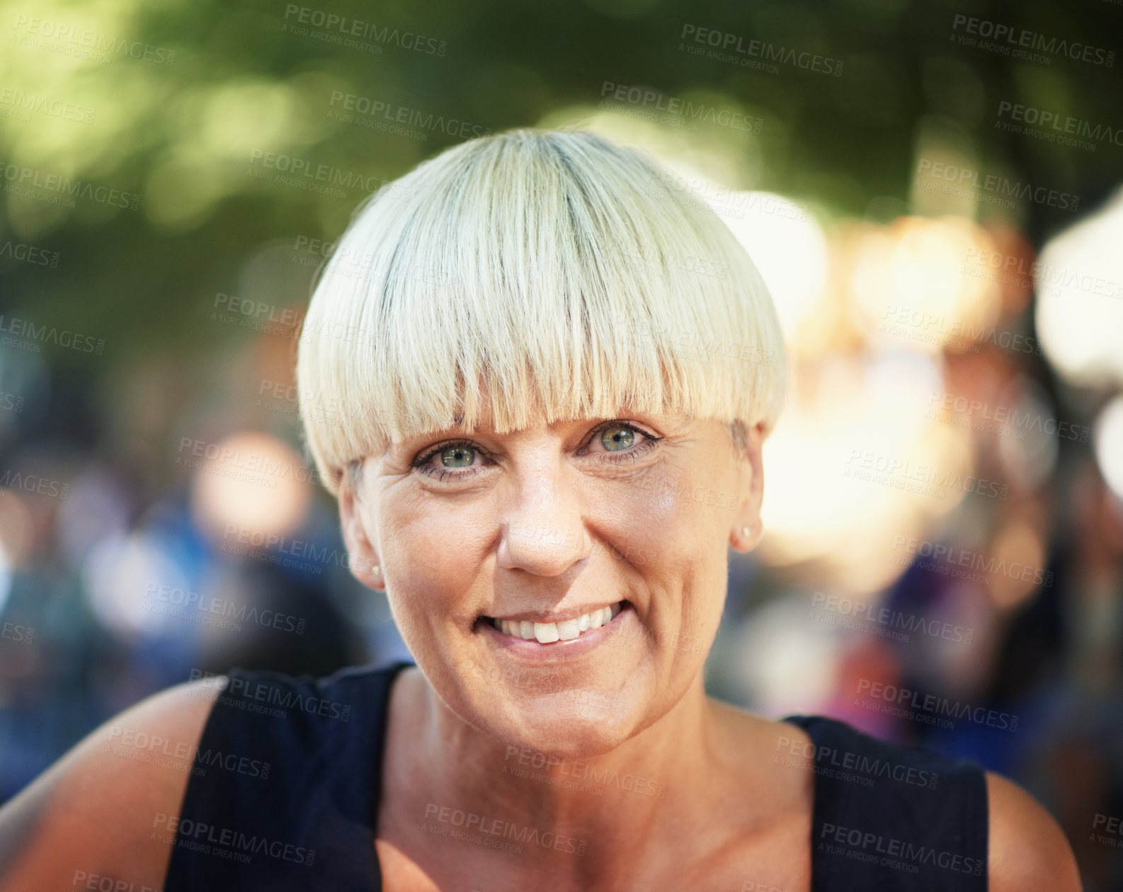 Buy stock photo Portrait of mature woman in park with smile, nature and relax in forest for outdoor event. Happiness, celebration with adventure party and freedom, face of person with sunshine and bokeh on vacation.
