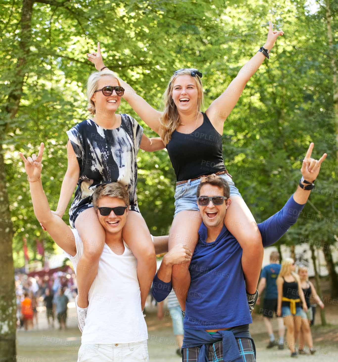 Buy stock photo Couple of friends, carrying and woman on shoulders at music festival, celebration and cheers of fans. Happy, people or rock n roll portrait at social event or men support girlfriends for fun games