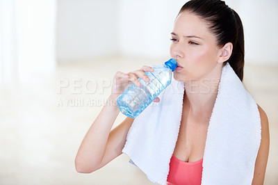 Buy stock photo Young woman drinking water after a gym session