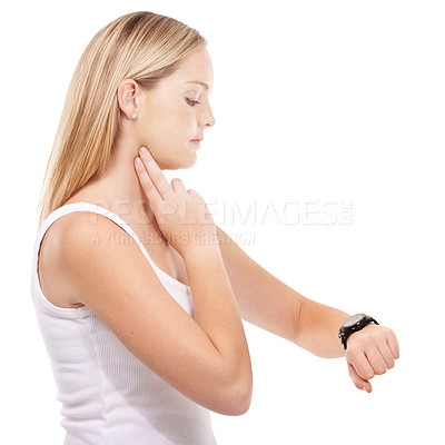 Buy stock photo Young woman taking her pulse rate against a white background