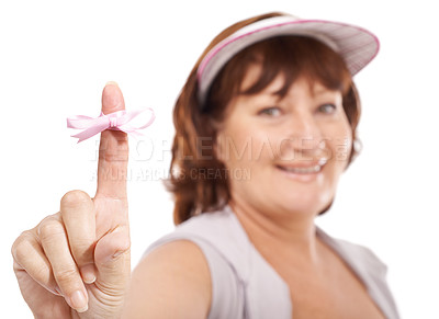 Buy stock photo Mature woman showing you breast cancer awareness ribbon against a white background