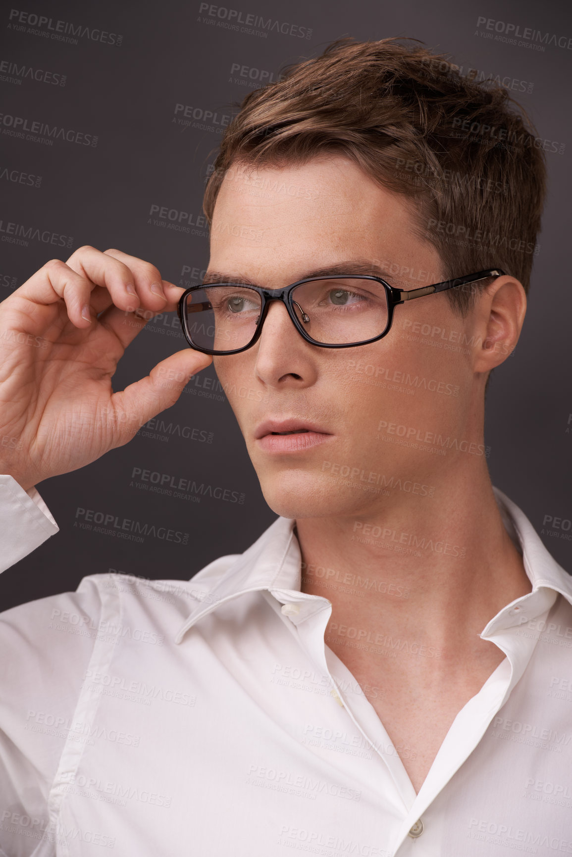 Buy stock photo Man, thinking and serious nerd with glasses, fashion or choice in eyewear on dark background of studio. Optometry, check and geek with spectacles, style and person with prescription lenses in frame 