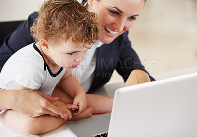 Buy stock photo Working, mom and happy with baby on laptop for business, work or multitask motherhood and career. Busy, mother and woman in a suit smile with love, care and reading on computer with child in home