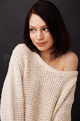 Buy stock photo Shy, sweater and woman on dark background for fashion, winter style and trendy clothes. Natural beauty, shoulder and face of attractive person in jersey for cozy, comfort and warm clothing in studio