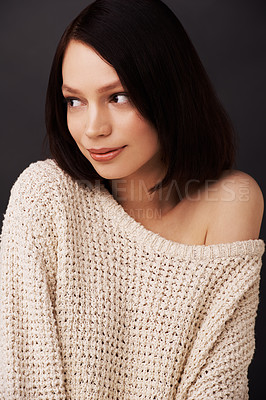 Buy stock photo Fashion, jersey and face of woman on dark background for natural beauty, winter style and trendy clothes. Model, shoulder and closeup of shy person with sweater for cozy, comfort and warm in studio