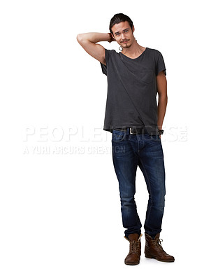 Buy stock photo Laid-back young man with a ponytail posing casually for the camera