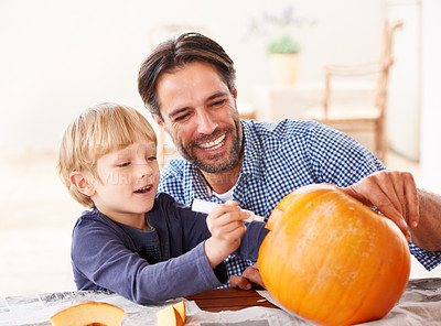 Buy stock photo Father, child and drawing on pumpkin to celebrate halloween, fun craft and decoration at home. Happy boy kid, dad and family writing with marker on vegetable for holiday lantern, party and creativity