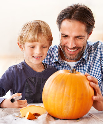 Buy stock photo Child, father and smile for drawing on pumpkin, craft and celebrate halloween party at home. Happy boy kid, dad and family writing with pen marker on vegetable, holiday lantern or creative decoration