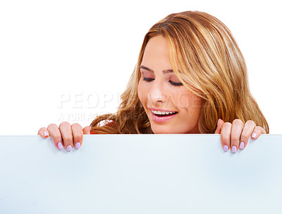 Buy stock photo Woman, poster and peeking at information in studio for news communication, announcement or white background. Female person, billboard placard as mockup space for promotion, advertising or signage